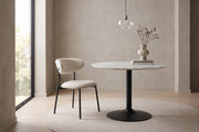 Héloïse beige chenille curved-back dining chair on black metal legs, set of 2 in a calm, daylit dining room
