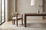 Henri beige dining armchair with a walnut-finish rubberwood frame in a calm, daylit dining room