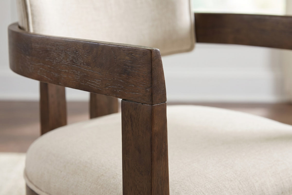Close-up of a curved arm rail meeting its square back leg, showing the wire-brushed walnut grain (Henri)