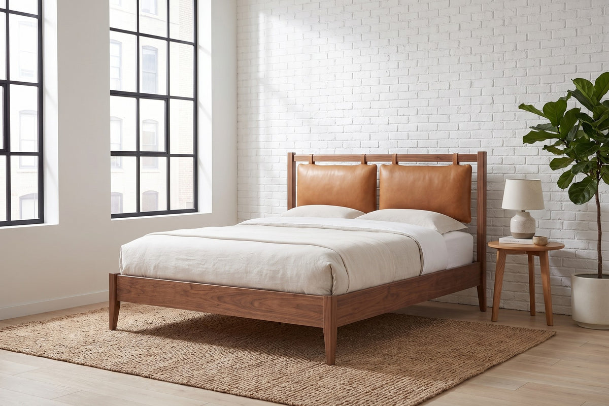 Honfleur Walnut Bed with Cognac Leather Cushions in a room