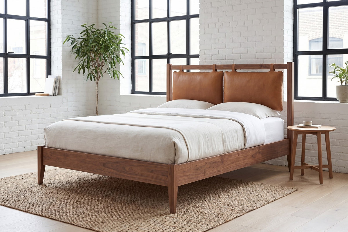 Honfleur Walnut Bed with Cognac Leather Cushions in a room setting