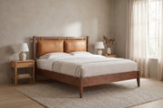 Honfleur Walnut Bed with Cognac Leather Cushions in a living space