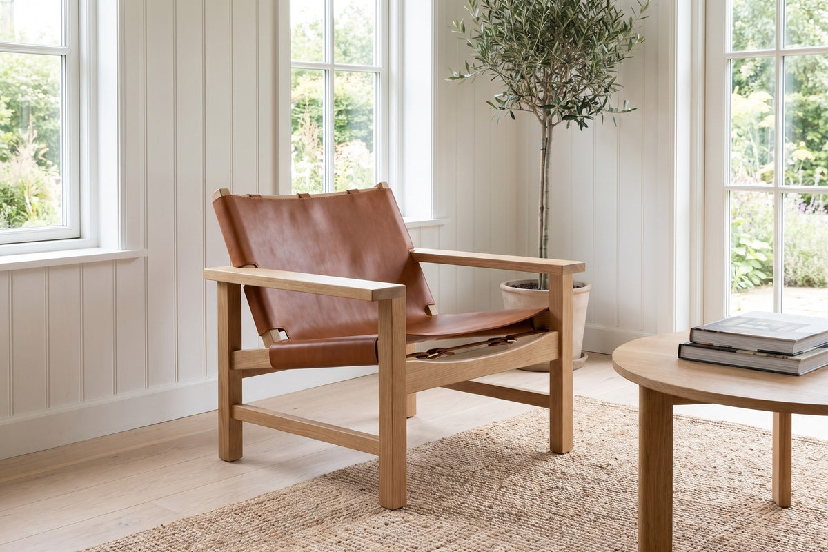 Lourmarin Cognac Leather Sling Chair on Natural Oak in a room