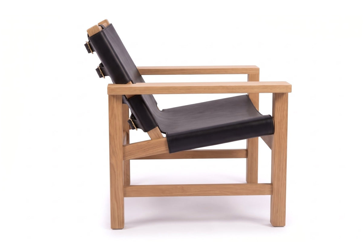 Lourmarin Leather Sling Chair in Black / Natural Oak, side view on white