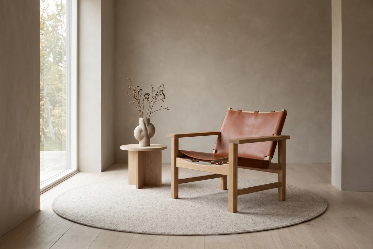 Lourmarin Cognac Leather Sling Chair on Natural Oak styled in a room