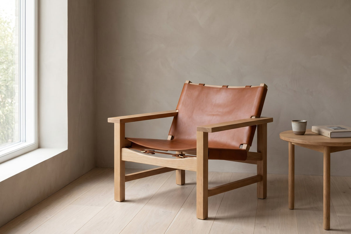 Lourmarin Cognac Leather Sling Chair on Natural Oak in a room setting