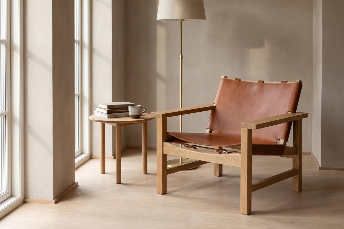 Lourmarin Cognac Leather Sling Chair on Natural Oak in a living space