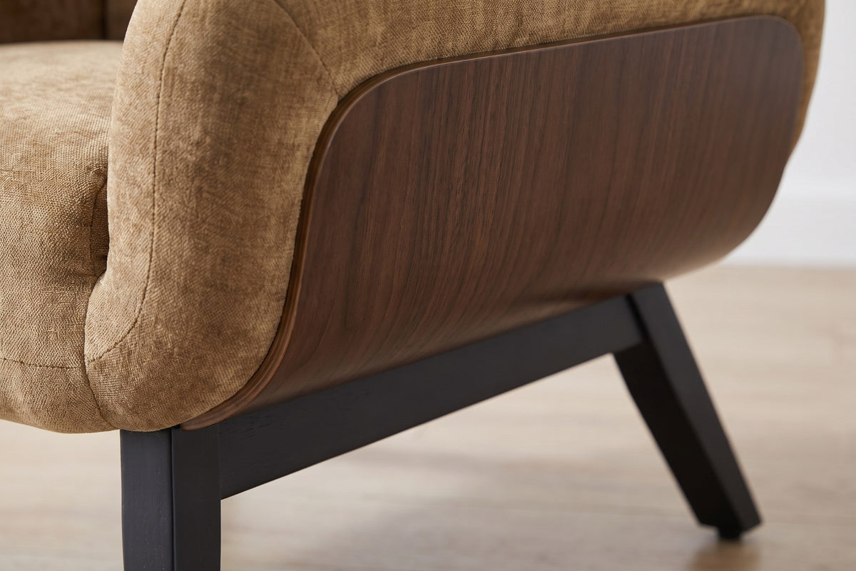 Close-up of the walnut-finish side panel meeting a black splayed leg (Lucie)