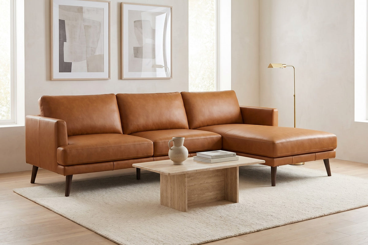 Luxembourg cognac tan leather l-sectional with right-facing chaise in a calm living room with framed prints
