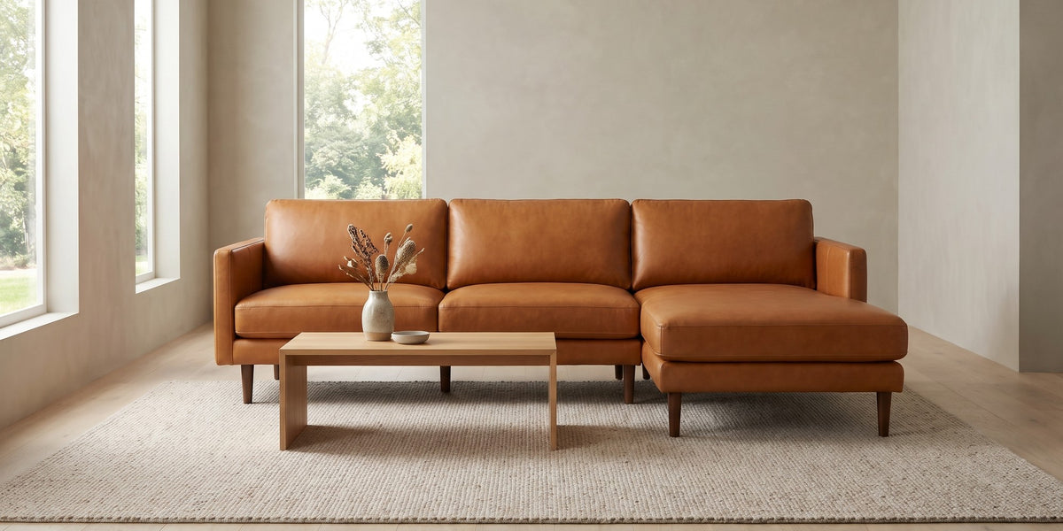 Luxembourg cognac tan leather l-sectional with right-facing chaise in a wide room view