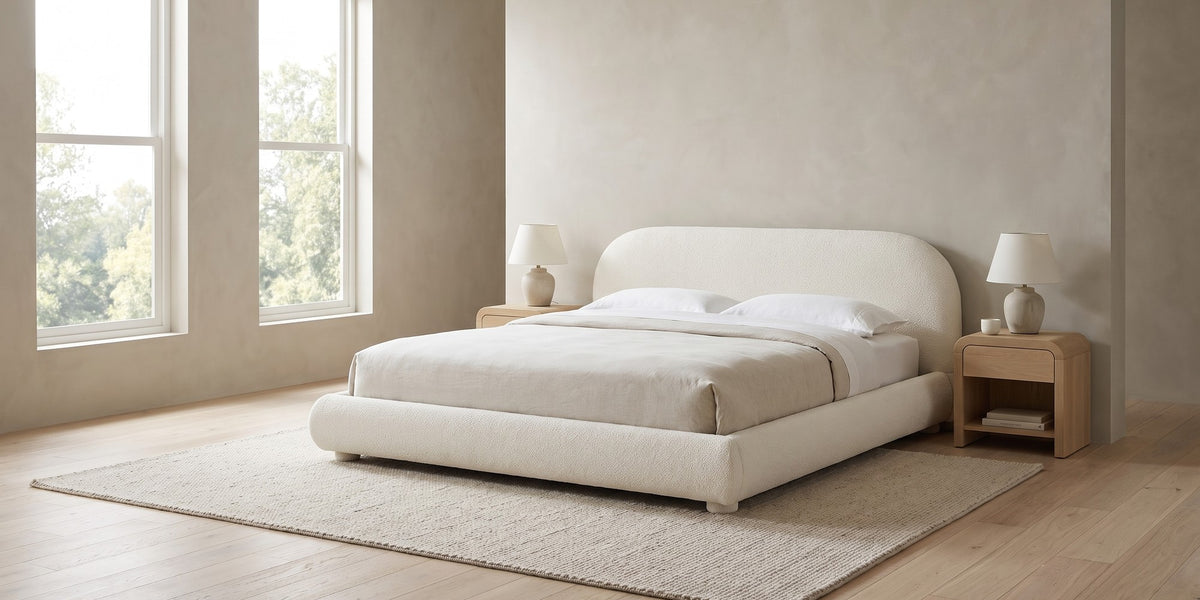 Manon cream bouclé bed with an arched headboard in a wide, calm bedroom