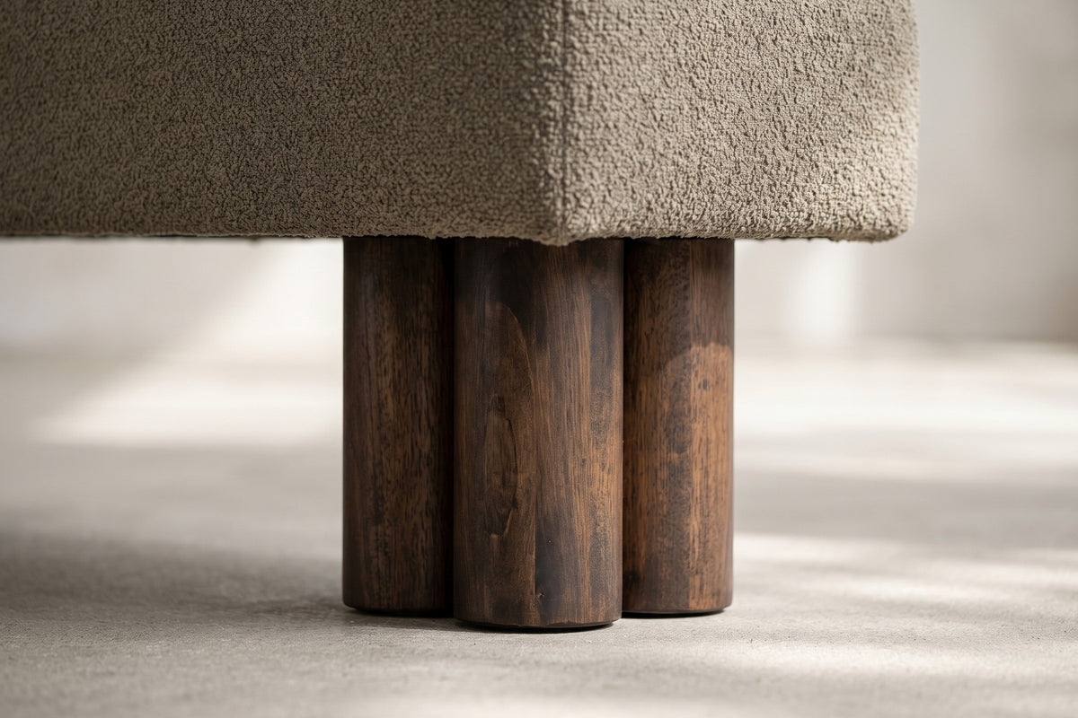 Close-up of a cluster of three round walnut-finish legs