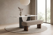 Margaux khaki bouclé bench at the Rivoli stone dining table in a calm daylit dining room