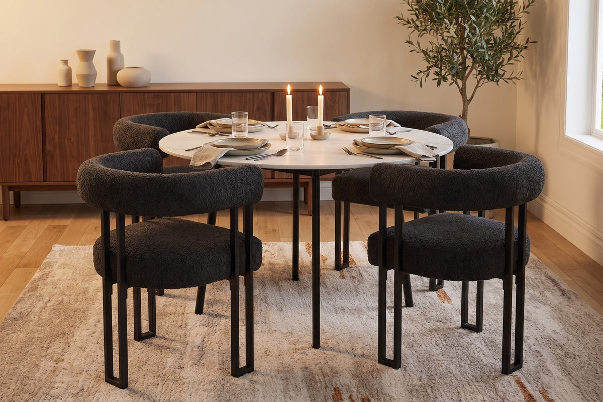 Mathilde black bouclé barrel dining armchair with black metal legs set for dinner for four