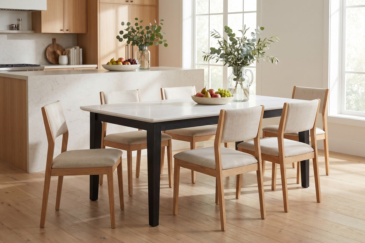 Ménerbes White Quartz Dining Table in Black Oak, in a room setting