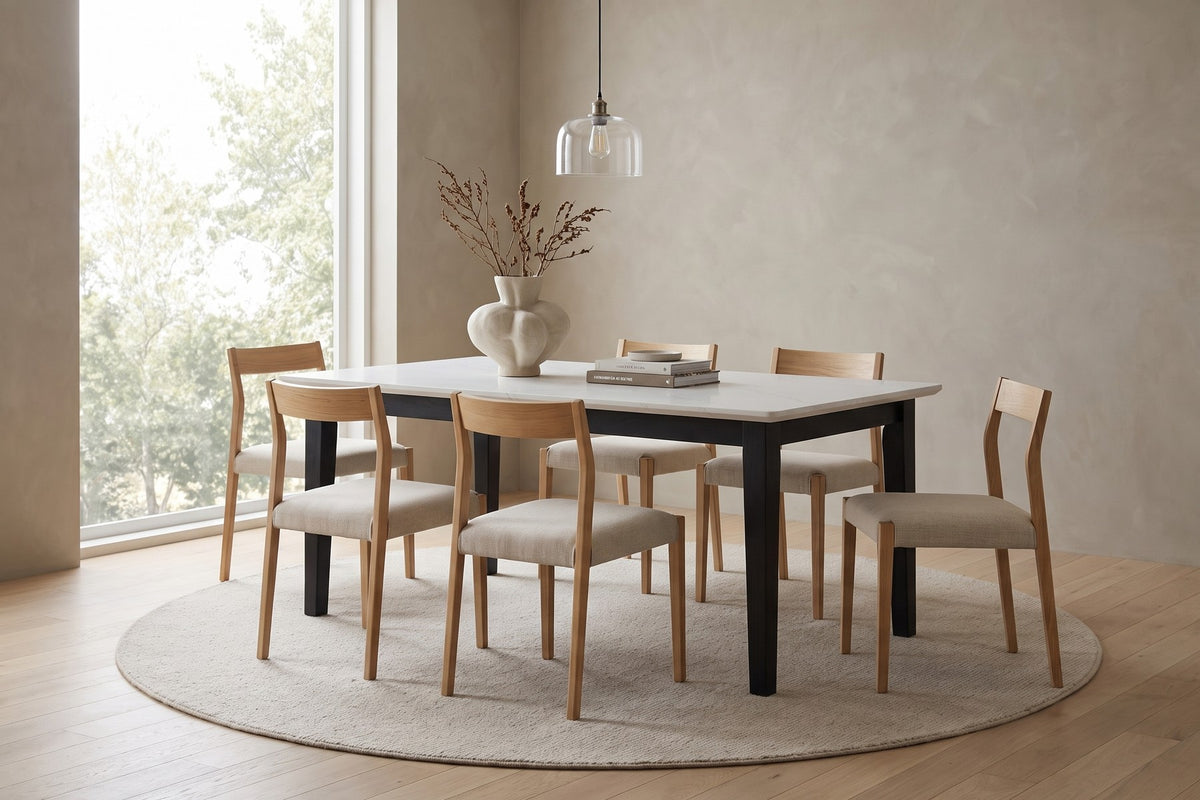 Ménerbes White Quartz Dining Table in Black Oak, in a living space