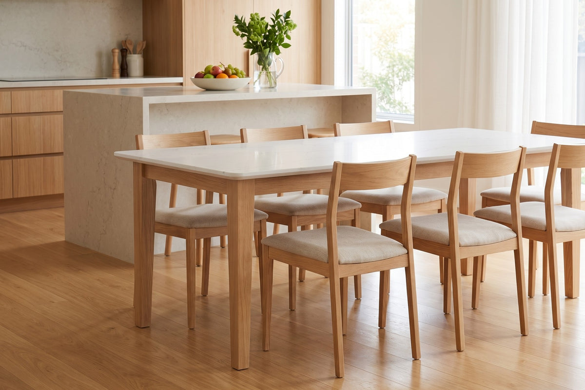 Ménerbes White Quartz Dining Table in Natural Oak, in a room setting