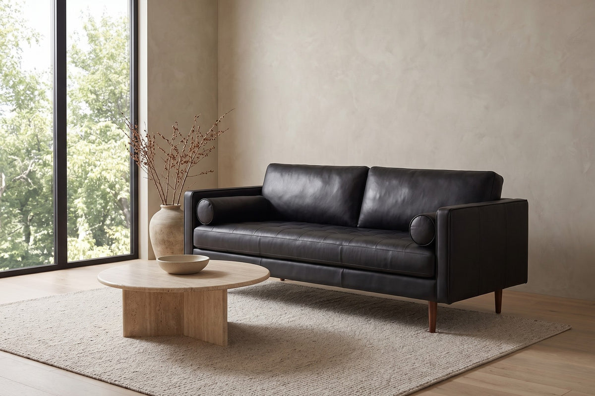 Menton Leather Sofa in Black, in a living space