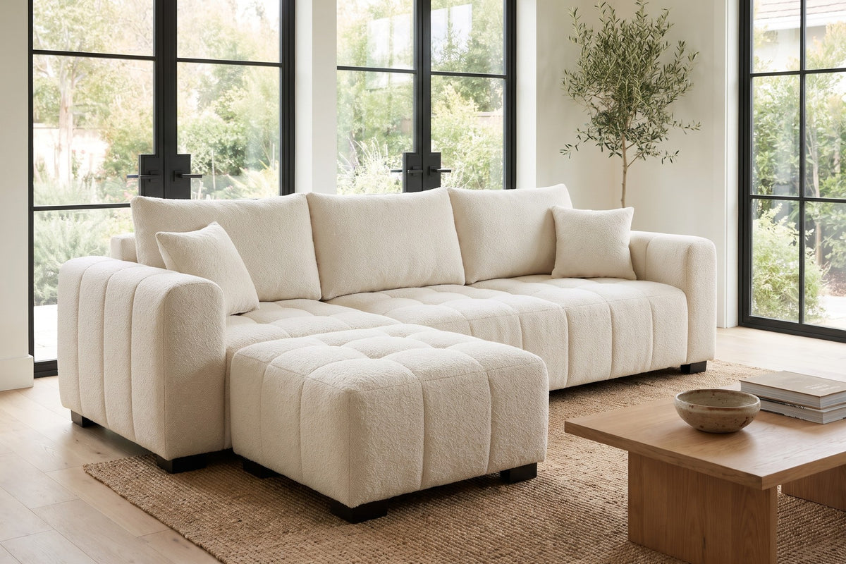 Montmartre 110" cream boucle modular sectional with movable ottoman in a bright sunroom-style living room
