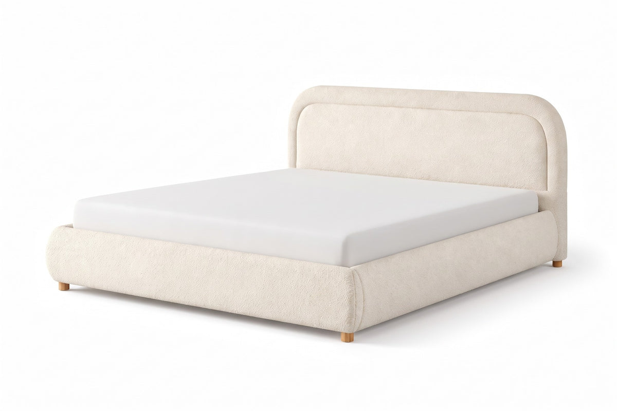 Nina beige-white bouclé platform bed with a rounded headboard, three-quarter view from the foot of the bed, slightly above on a white background