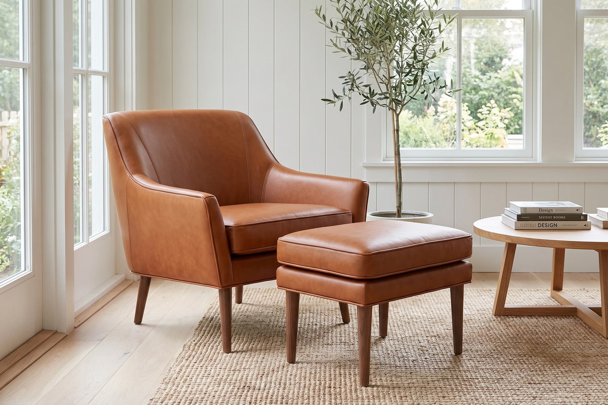 Nyons Cognac Leather Armchair and Ottoman in a room