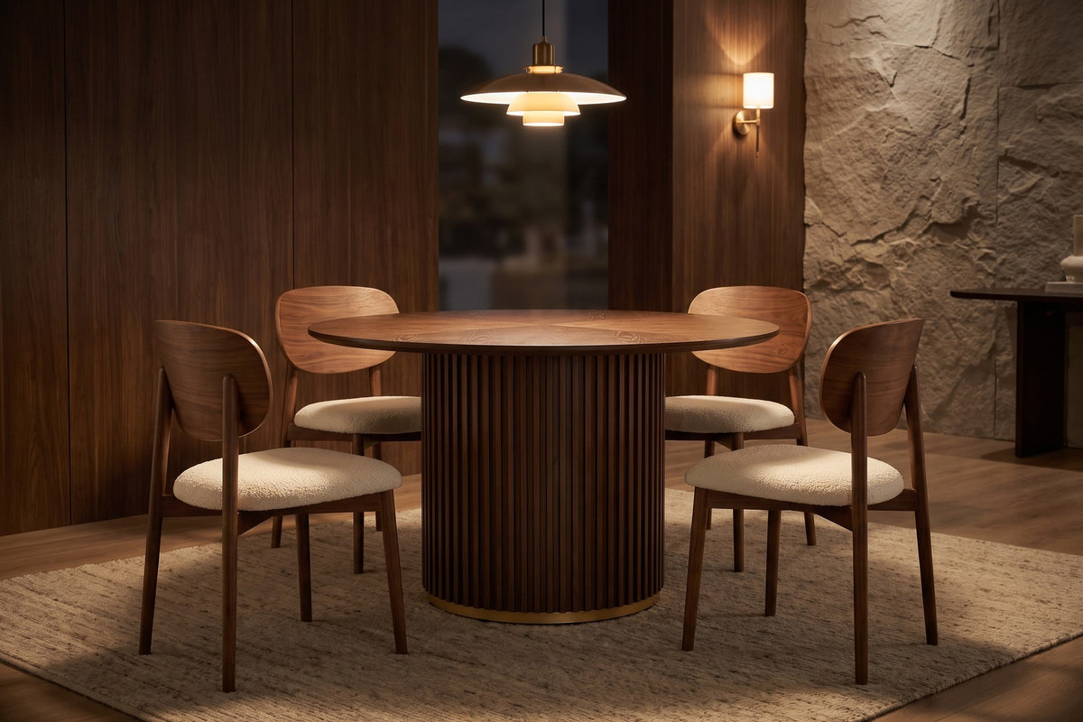 After dark. Four chairs around the drum, the wedge-laid grain catching the pendant light.
