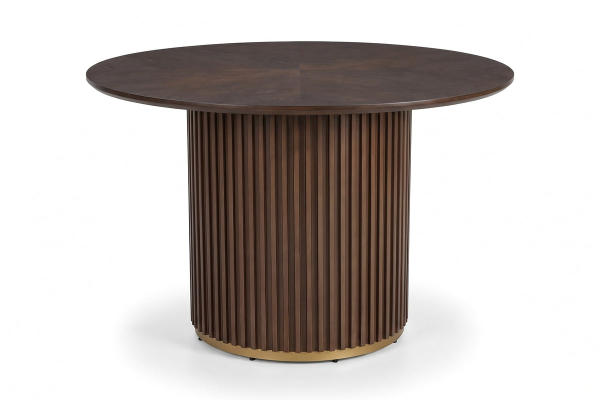 Odeon 47-inch round walnut-finish dining table with a slatted drum pedestal, three-quarter view from slightly above, showing the round top and the slatted pedestal on a white background