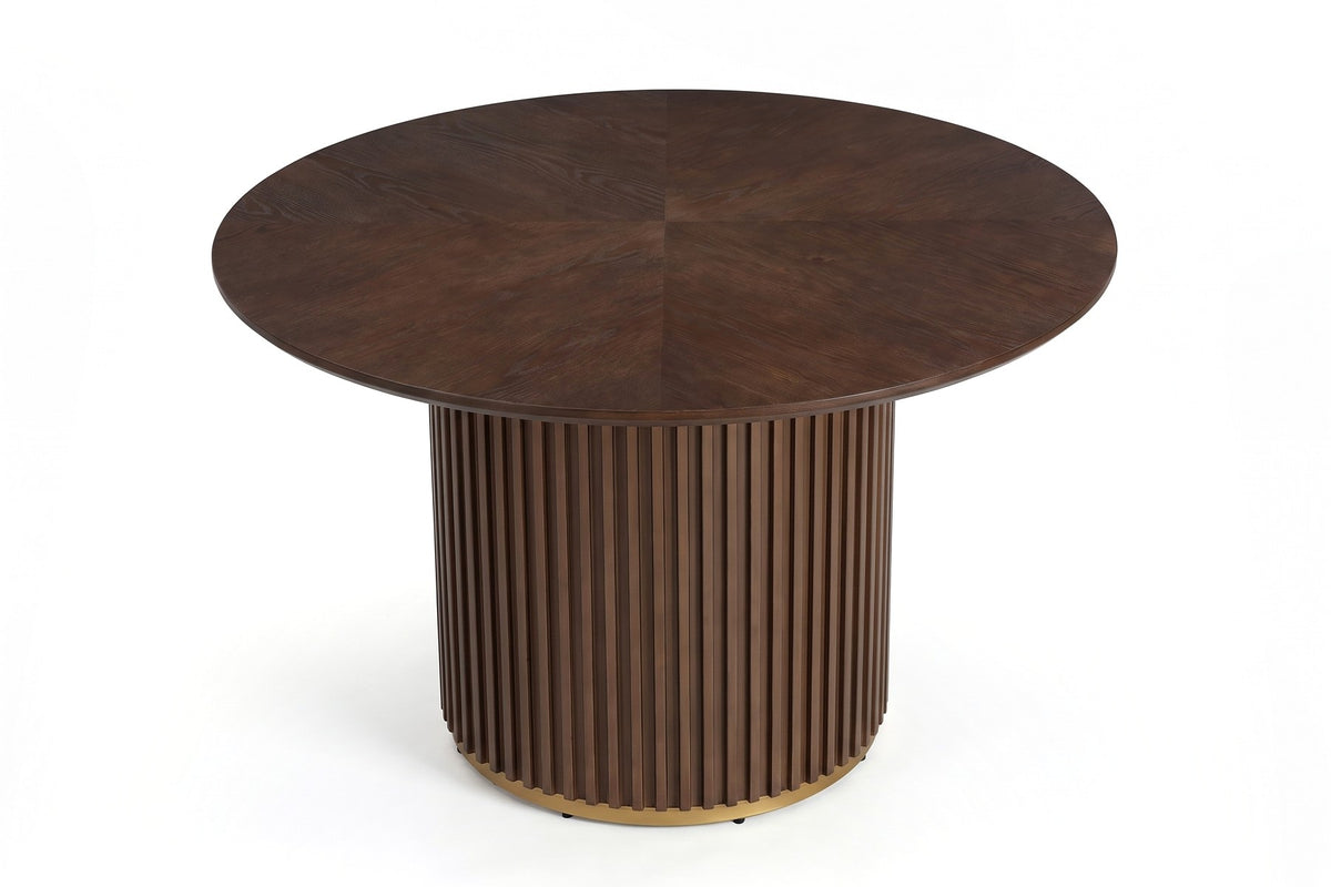 Odeon 47-inch round walnut-finish dining table with a slatted drum pedestal, view from high above, showing the full round top and its wedge grain pattern on a white background