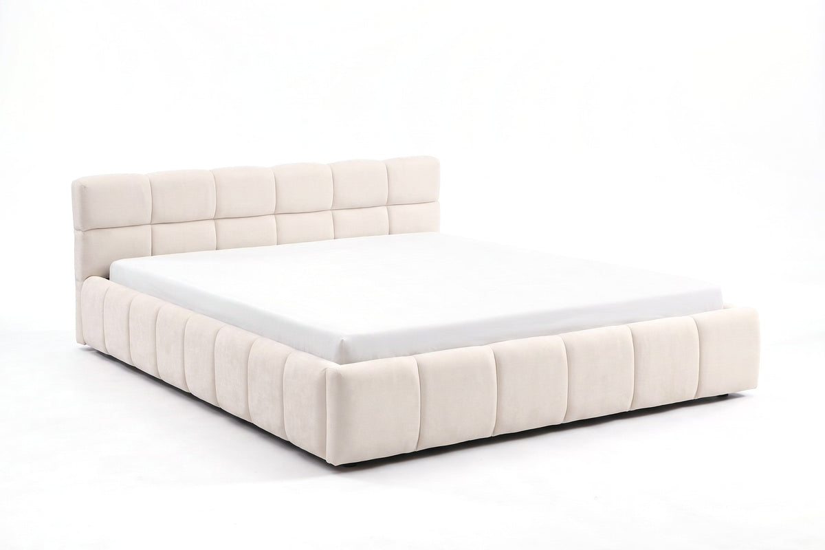 Odette cream-beige chenille queen bed with a square-tufted headboard on a white background, three-quarter view from the foot at mattress height, showing how low the frame sits