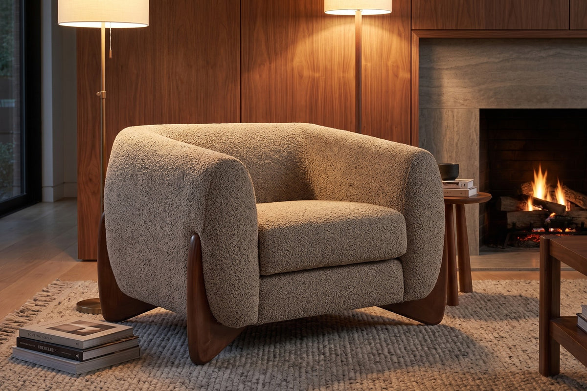 Evening. Two lamps, a lit fire and a deep seat: the flecked bouclé shows its texture.