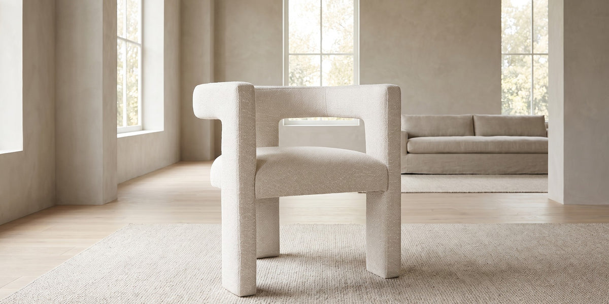 Picpus white bouclé sculpted accent chair with open back in a wide room view