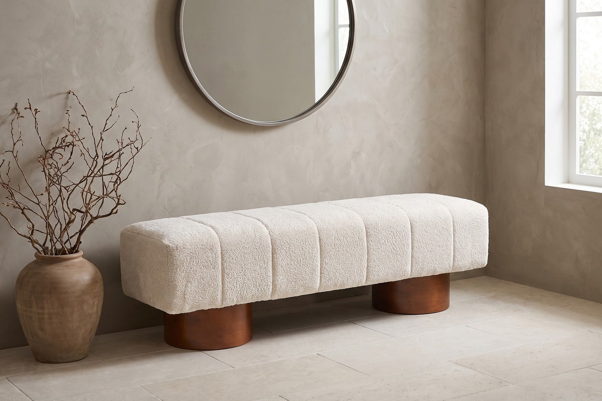 Pigalle cream bouclé channel bench with walnut-tone drum legs in a bright entryway