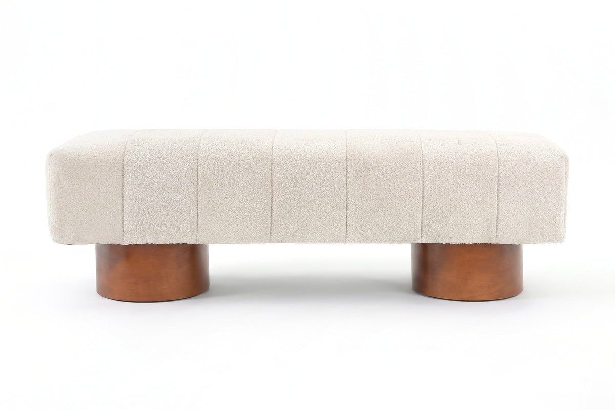 Pigalle cream bouclé channel bench with walnut-tone drum legs, straight front view on a white background