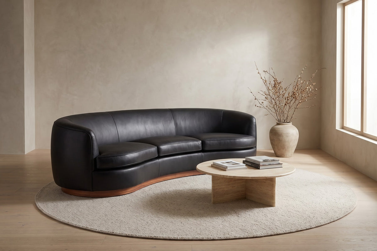 Pornic Curved Leather Sofa in Black, in a room setting