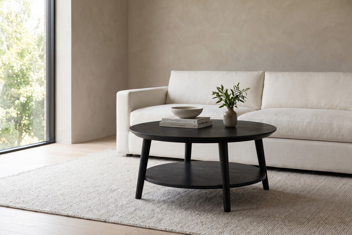 Ramatuelle Round Coffee Table in Black Oak, in a living space