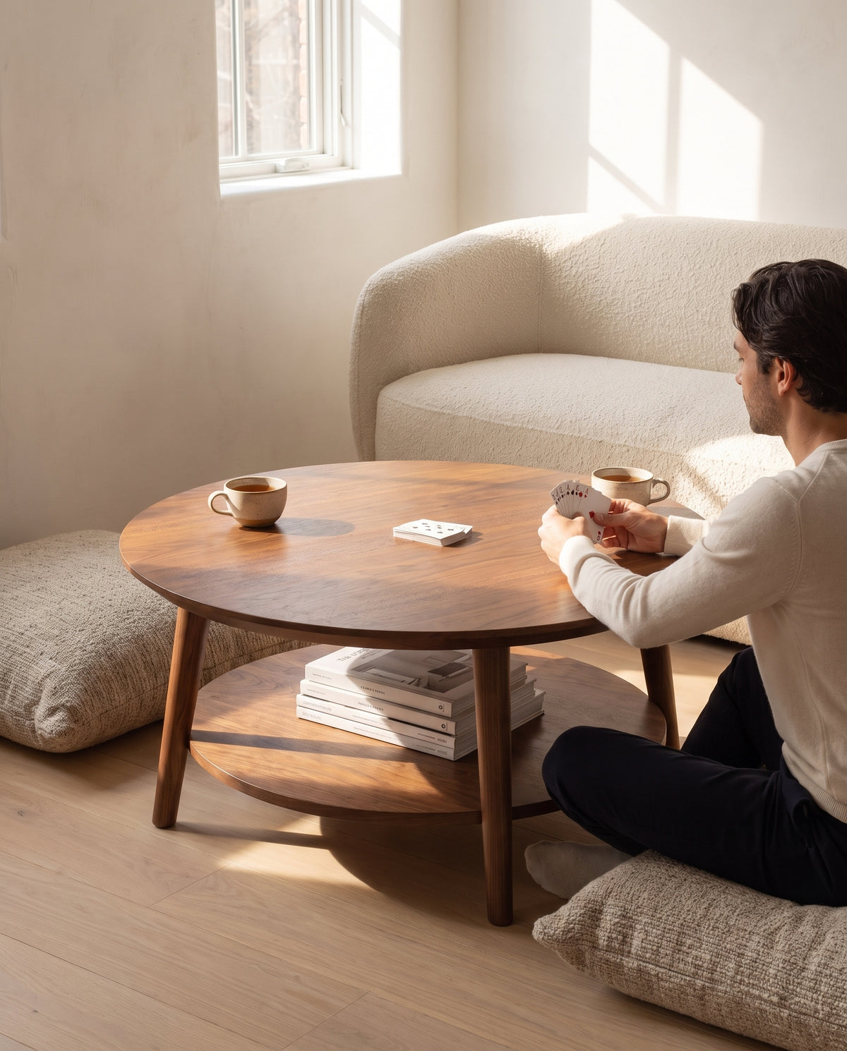 Ramatuelle Walnut Round Coffee Table in everyday use at home