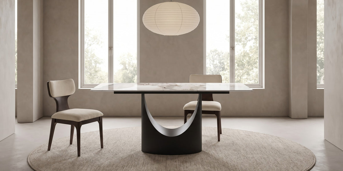 Rivoli sintered stone dining table with beige chenille chairs in a calm daylit dining room with a paper pendant lamp