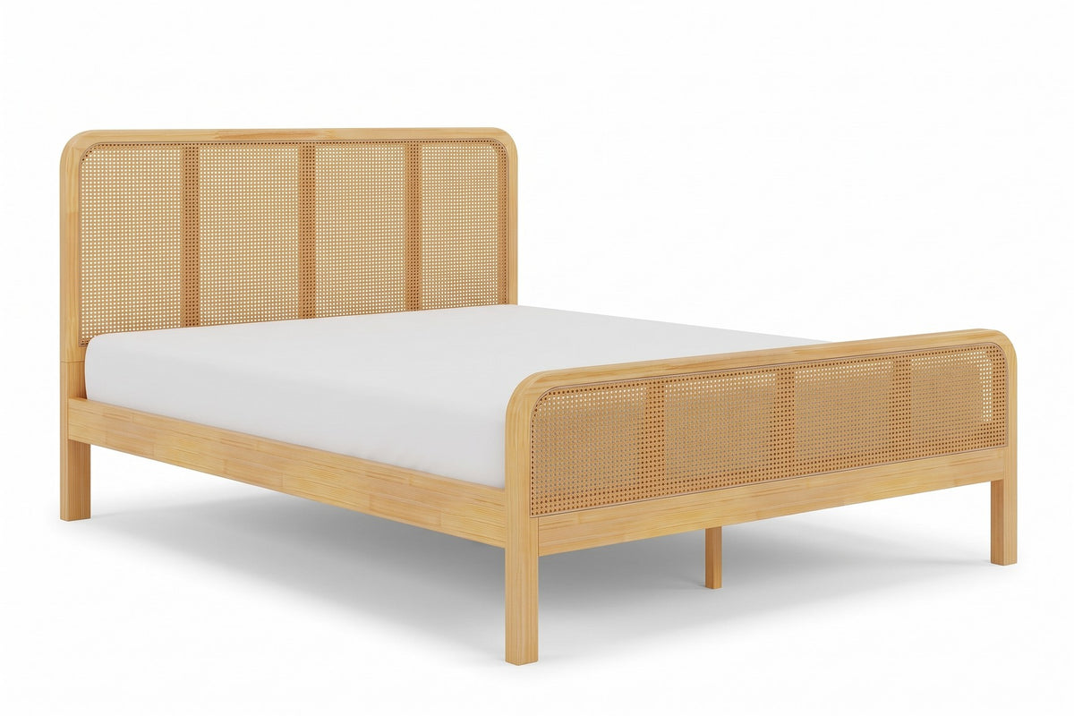 Romy natural solid wood platform bed with cane headboard and footboard, three-quarter view from the foot of the bed, slightly above on a white background