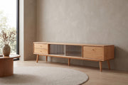 Rosalie 70.9" solid beech media console with fluted glass doors in a calm, daylit living room