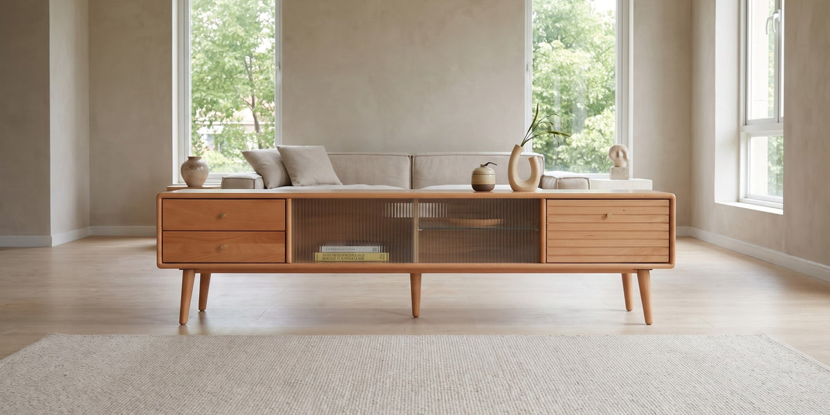 Rosalie 70.9" solid beech media console with fluted glass doors in a wide room view