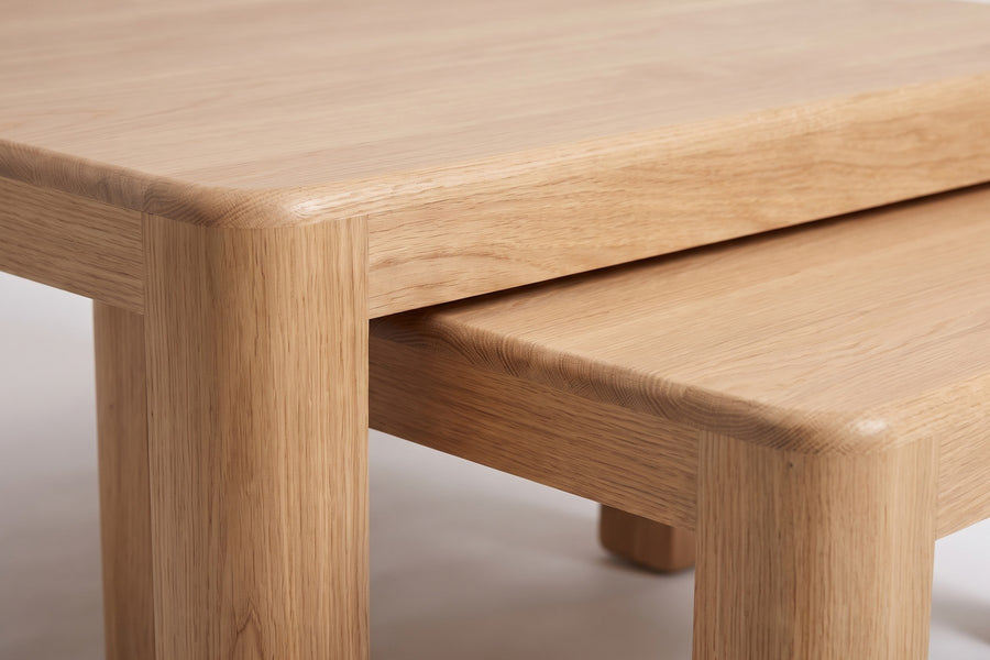 Roussillon Oak Nesting Coffee Tables: close-up of the small table sliding out from under the large one, showing the gap between them