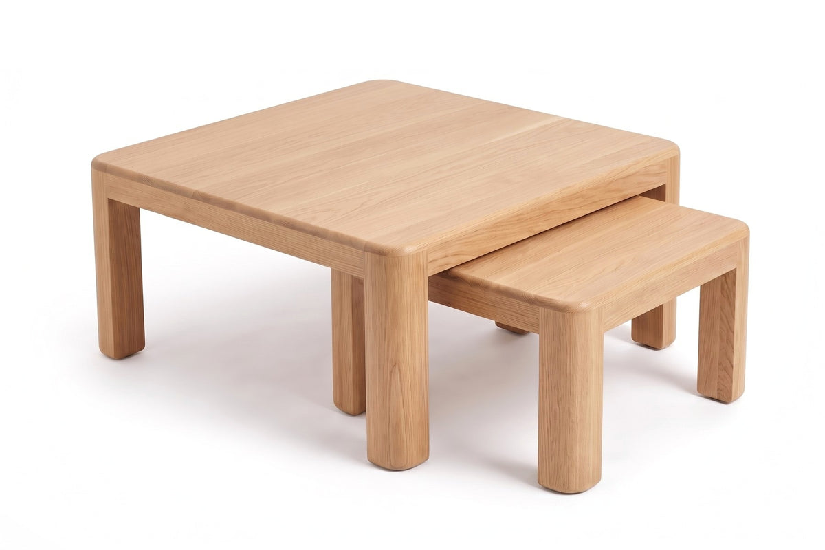 Roussillon Oak Nesting Coffee Tables, three-quarter view from slightly above, with the small table tucked under one corner of the large one