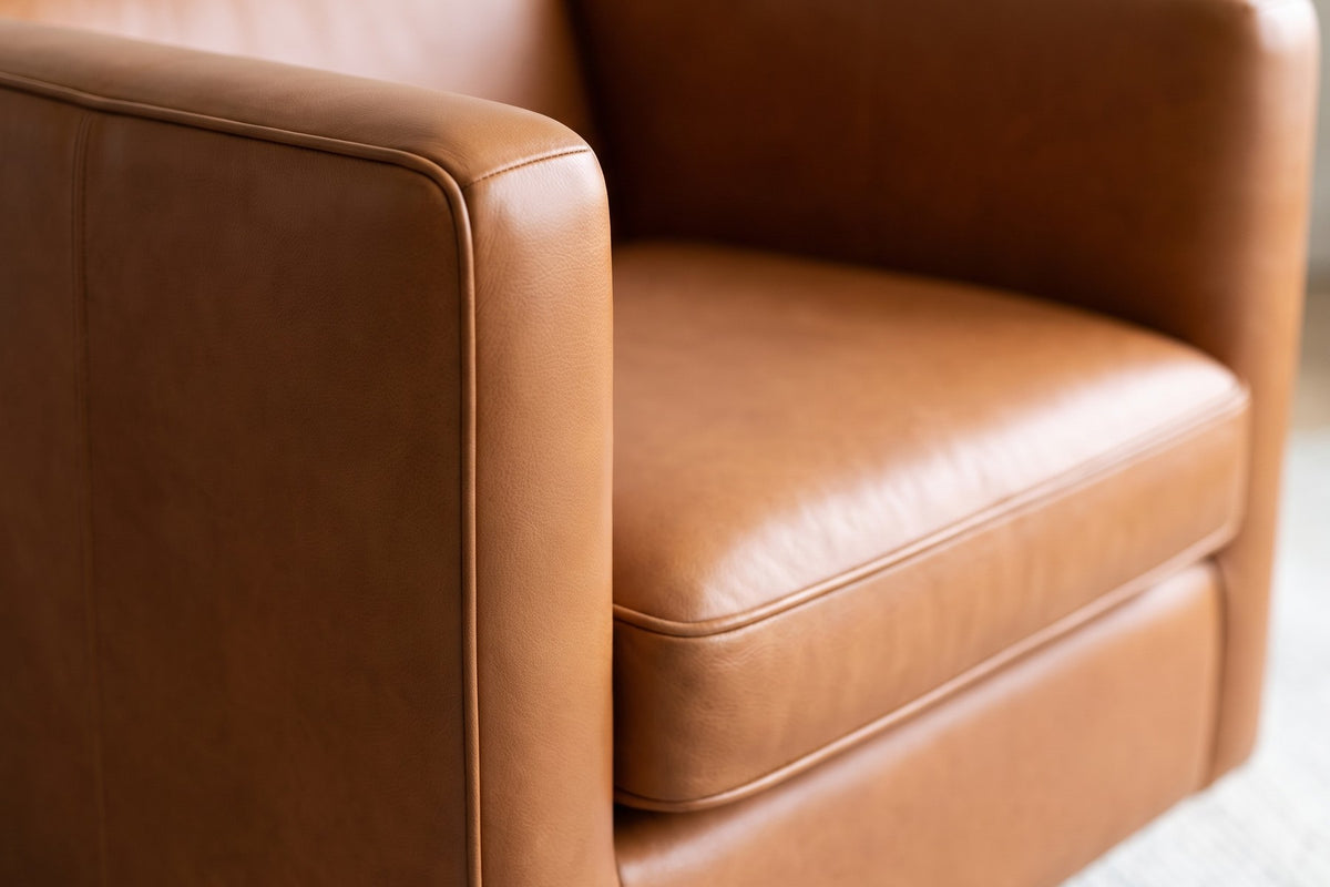 Sarlat Leather Swivel Club Chair – Tuxedo Arms, Floating Plinth Base, 360° Swivel