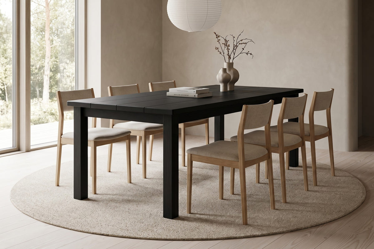 Sète Plank Dining Table in Black Oak, in a living space