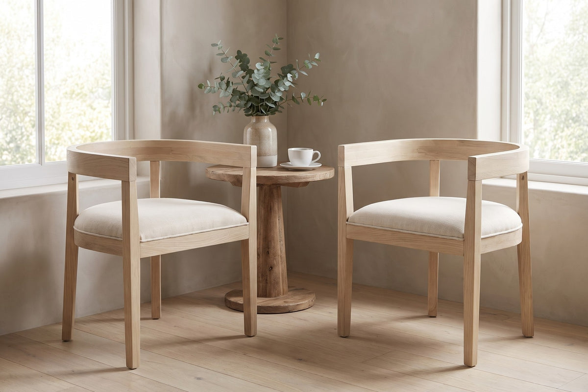 Simone horseshoe-back dining chair in light ash rubberwood with a beige seat in a bright breakfast nook