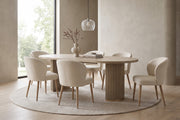 Tuileries 88-inch oval dining table with two fluted pedestals in a light natural finish in a calm, daylit dining room