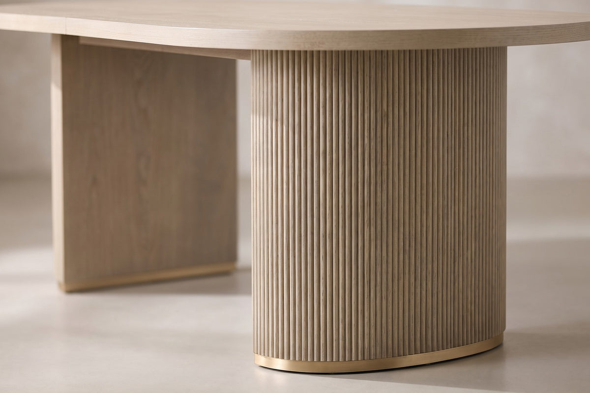 Close-up of the vertical fluting on one half-round pedestal and the slim gold-tone band at its foot (Tuileries)