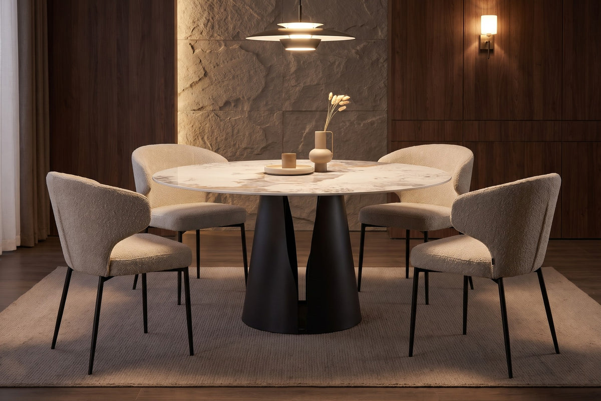 Valentine 59" round white sintered stone dining table on a black cone pedestal in a warm walnut-panelled dining room in the evening