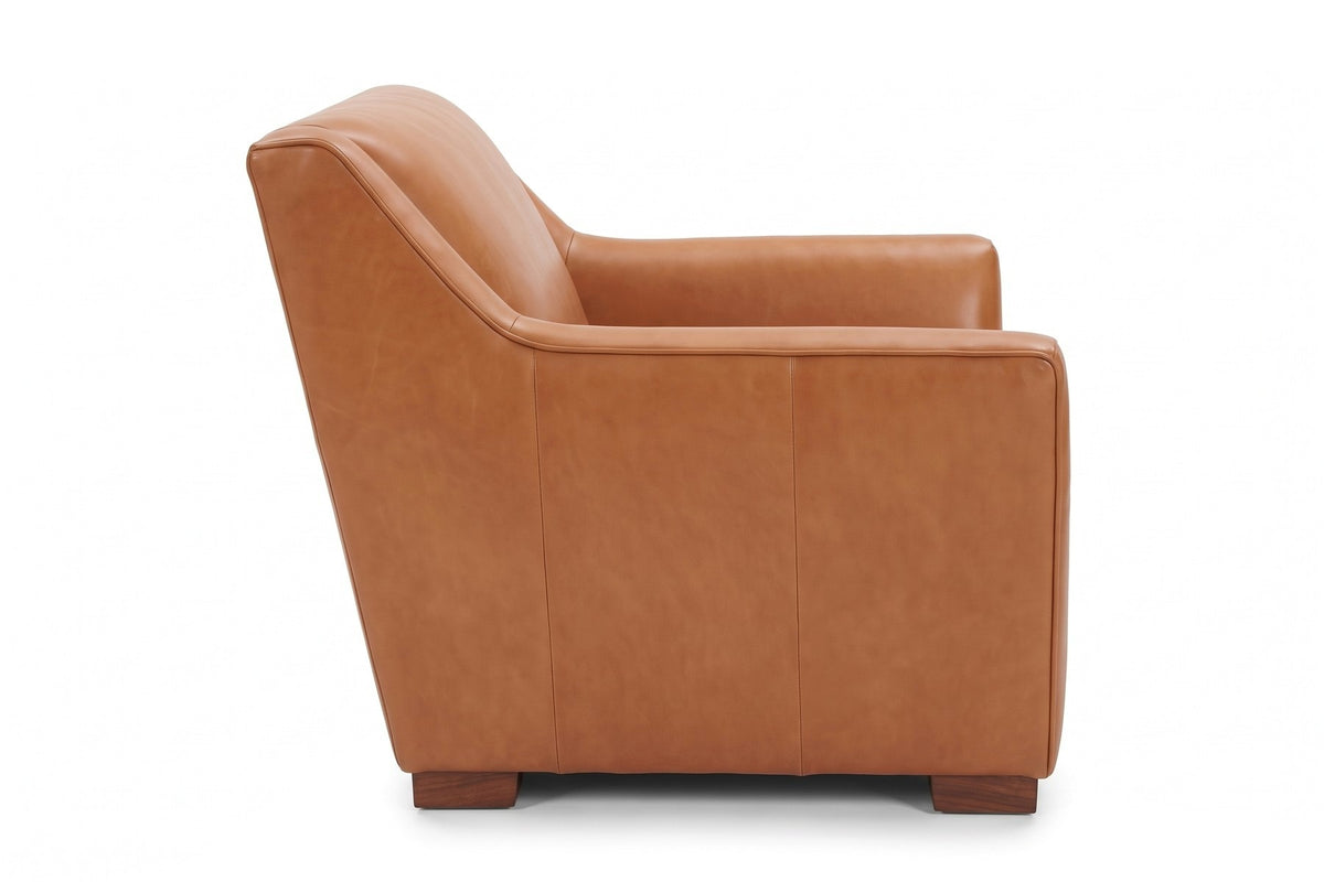 Vence Cognac Leather Lounge Chair, straight side view from the right at seat height, showing the sloped arm profile and the reclined back