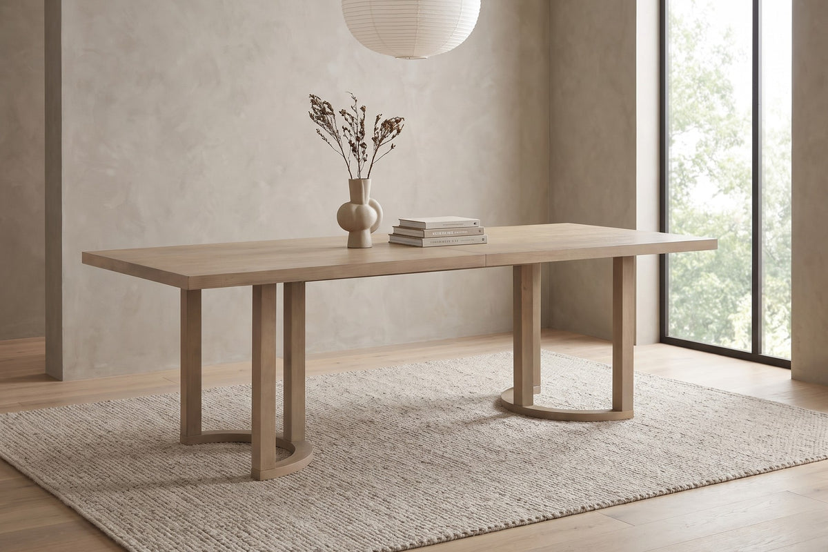 Villette 95-inch light ash dining table with U-shaped bases in a calm, daylit dining room